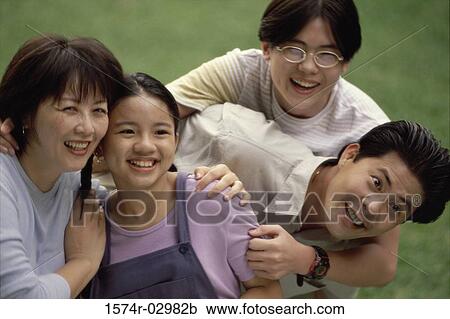 Stock Image - Parents with their son and daughter. Fotosearch
