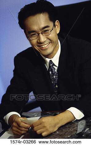 Stock Photograph - Portrait of a businessman smiling. Fotosearch