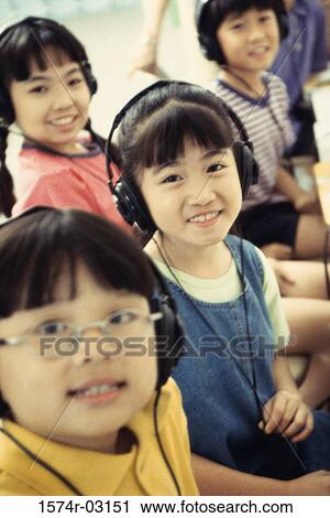 Portrait of a group of children wearing headphones smiling View Large Photo Image Stock Image - Portrait of a group of children wearing headphones smiling. Fotosearch