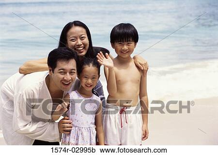 Portrait of parents with their son and daughter on the beach View Large Photo Image Stock Image - Portrait of parents with their son and daughter on the beach. Fotosearch
