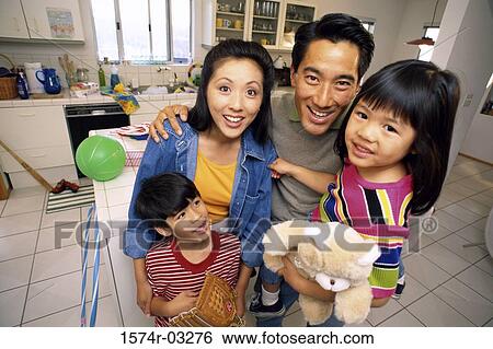 Stock Photograph - Portrait of parents with their son and daughter. Fotosearch
