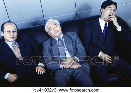 Three businessmen sitting on a couch in an office View Large Photo Image Stock Image - Three businessmen sitting on a couch in an office. Fotosearch