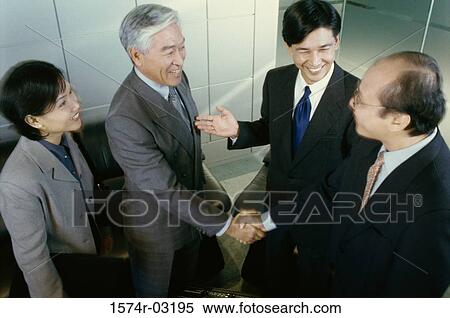 Stock Photography - Two businessmen shaking hands. Fotosearch