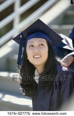 Young female graduate smiling View Large Photo Image Stock Image - Young female graduate smiling. Fotosearch
