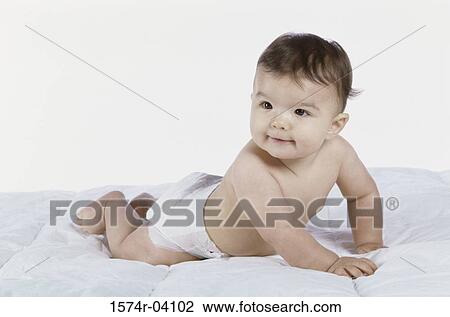 Baby boy crawling on a bed View Large Photo Image Stock Image - Baby boy crawling on a bed. Fotosearch