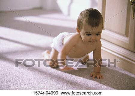Baby boy crawling on the floor View Large Photo Image Stock Photo - Baby boy crawling on the floor. Fotosearch
