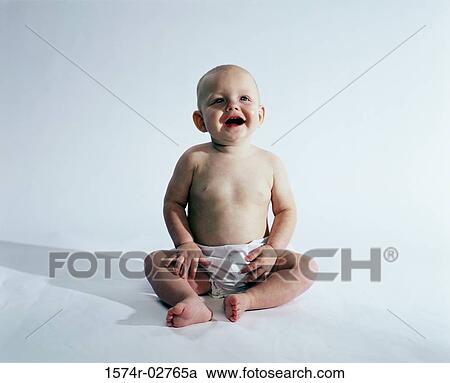 Baby boy sitting and smiling View Large Photo Image Stock Image - Baby boy sitting and smiling. Fotosearch