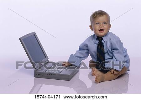 Baby boy touching a laptop View Large Photo Image Stock Image - Baby boy touching a laptop. Fotosearch