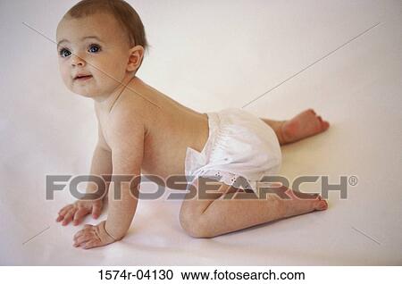 Baby girl crawling on the floor View Large Photo Image Stock Image - Baby girl crawling on the floor. Fotosearch