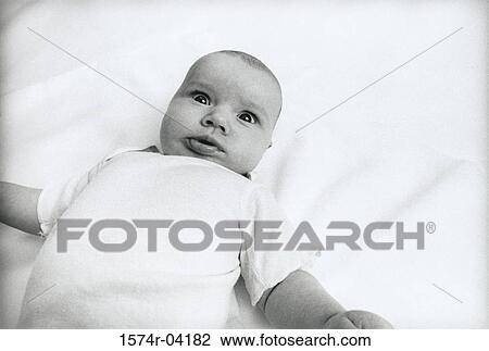 Close-up of a baby boy making a face View Large Photo Image Stock Image - Close-up of a baby boy making a face. Fotosearch