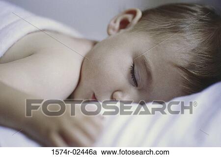 Close-up of a baby boy sleeping View Large Photo Image Stock Image - Close-up of a baby boy sleeping. Fotosearch
