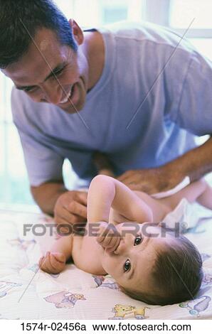 Father looking at his baby boy View Large Photo Image Stock Image - Father looking at his baby boy. Fotosearch