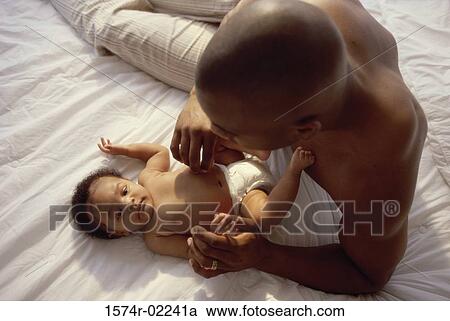 Father tickling his baby boy View Large Photo Image Stock Image - Father tickling his baby boy. Fotosearch