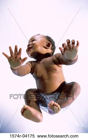 Low angle view of a baby boy crawling on glass View Large Photo Image Stock Photography - Low angle view of a baby boy crawling on glass. Fotosearch
