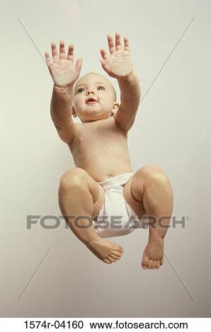 Low angle view of a baby girl crawling View Large Photo Image Stock Image - Low angle view of a baby girl crawling. Fotosearch