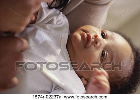 Person holding a baby boy View Large Photo Image Stock Image - Person holding a baby boy. Fotosearch