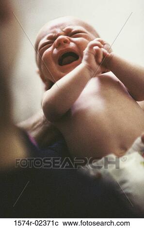 Person holding a baby boy View Large Photo Image Stock Image - Person holding a baby boy. Fotosearch