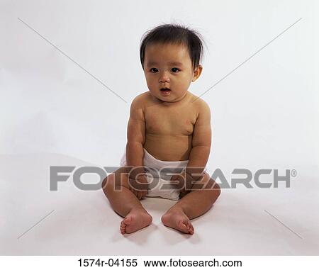 Stock Photography - Portrait of a baby boy in diapers. Fotosearch