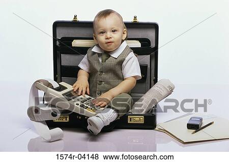 Portrait of a baby boy sitting in an open briefcase holding an adding machine View Large Photo Image Stock Photo - Portrait of a baby boy sitting in an open briefcase holding an adding machine. Fotosearch