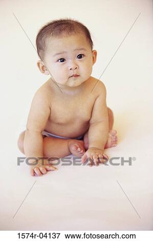 Portrait of a baby boy sitting View Large Photo Image Stock Photo - Portrait of a baby boy sitting. Fotosearch