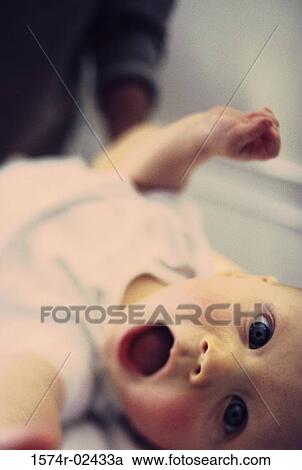 Portrait of a baby boy with his mouth wide open View Large Photo Image Stock Image - Portrait of a baby boy with his mouth wide open. Fotosearch