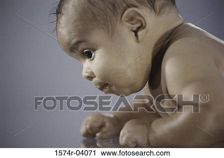 Side profile of a baby boy crawling View Large Photo Image Stock Image - Side profile of a baby boy crawling. Fotosearch