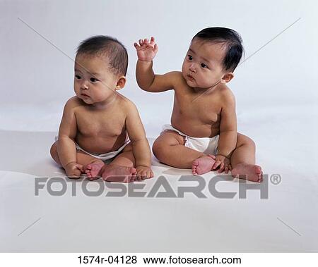 Stock Photo - Two baby boys wearing diapers. Fotosearch