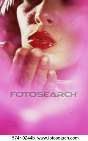 Close-up of a woman blowing kisses View Large Photo Image Stock Image - Close-up of a woman blowing kisses. Fotosearch