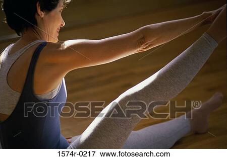 Close-up of a woman exercising View Large Photo Image Stock Photo - Close-up of a woman exercising. Fotosearch