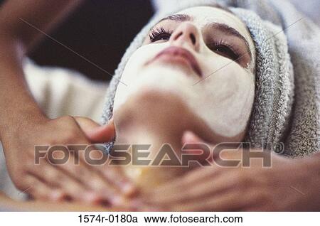 Close-up of a young woman getting a facial treatment View Large Photo Image Stock Image - Close-up of a young woman getting a facial treatment. Fotosearch