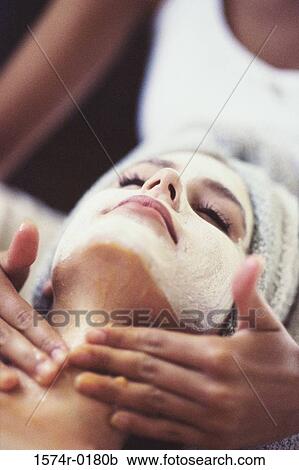 Close-up of a young woman getting a facial treatment View Large Photo Image Stock Image - Close-up of a young woman getting a facial treatment. Fotosearch