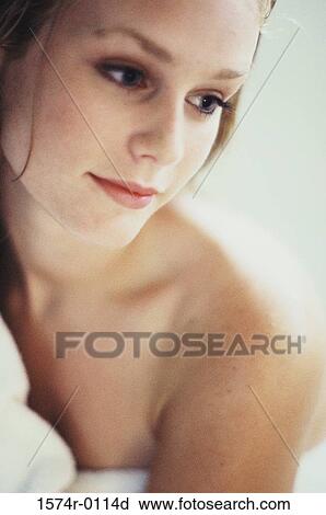 Close-up of a young woman's face and bare shoulders View Large Photo Image Stock Image - Close-up of a young woman's face and bare shoulders. Fotosearch