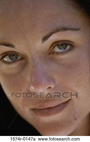 Close-up of a young woman's face View Large Photo Image Stock Image - Close-up of a young woman's face. Fotosearch