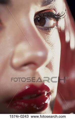 Stock Image - Close-up of a young woman's face. Fotosearch
