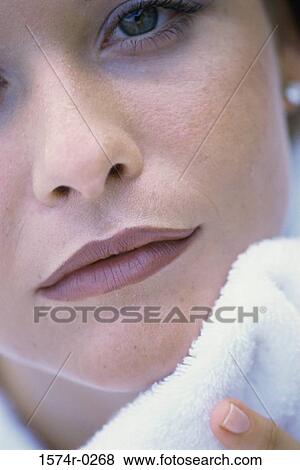 Close-up of a young woman's face View Large Photo Image Stock Photo - Close-up of a young woman's face. Fotosearch