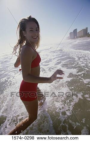 Stock Photo - Portrait of a woman at the beach. Fotosearch
