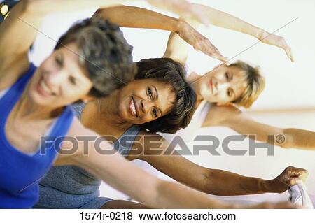 Portrait of three women exercising View Large Photo Image Stock Photo - Portrait of three women exercising. Fotosearch