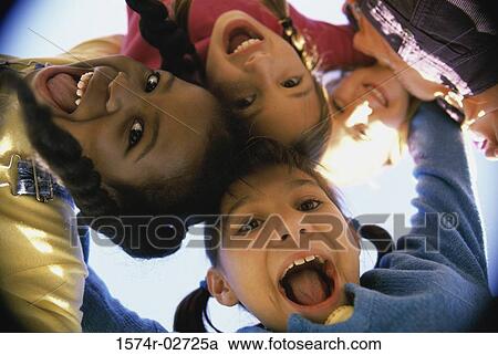 Close-up of a group of children in a huddle View Large Photo Image Stock Image - Close-up of a group of children in a huddle. Fotosearch