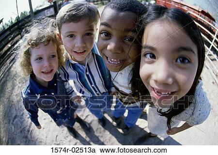 Stock Image - Close-up of a group of children standing. Fotosearch