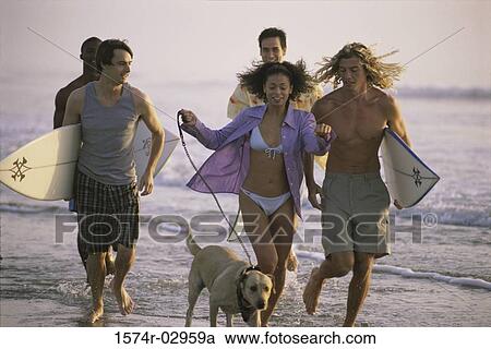 Group of young people running on the beach View Large Photo Image Stock Image - Group of young people running on the beach. Fotosearch