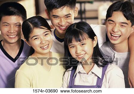 Stock Image - Portrait of a group of teenagers smiling. Fotosearch