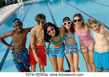 Portrait of a group of teenagers standing beside a swimming pool View Large Photo Image Stock Image - Portrait of a group of teenagers standing beside a swimming pool. Fotosearch