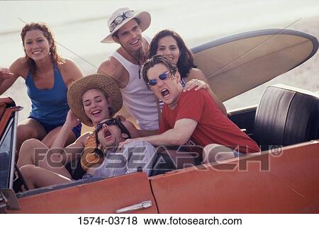 Portrait of a group of young people in a car View Large Photo Image Stock Photo - Portrait of a group of young people in a car. Fotosearch
