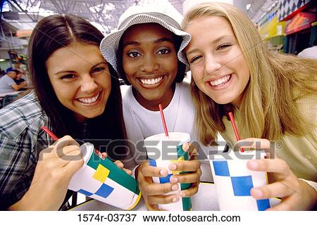 Portrait of three teenage girls smiling View Large Photo Image Stock Photo - Portrait of three teenage girls smiling. Fotosearch