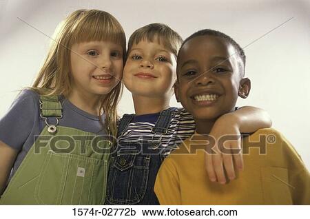 Portrait of two boys and a girl holding each other View Large Photo Image Stock Image - Portrait of two boys and a girl holding each other. Fotosearch