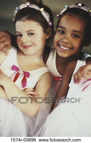 Portrait of two girls wearing ballet costumes View Large Photo Image Stock Photograph - Portrait of two girls wearing ballet costumes. Fotosearch
