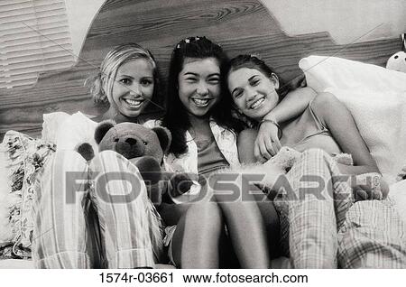 Three teenage girls at a slumber party View Large Photo Image Stock Image - Three teenage girls at a slumber party. Fotosearch