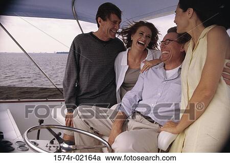 Two mid adult couples on a boat View Large Photo Image Stock Image - Two mid adult couples on a boat. Fotosearch