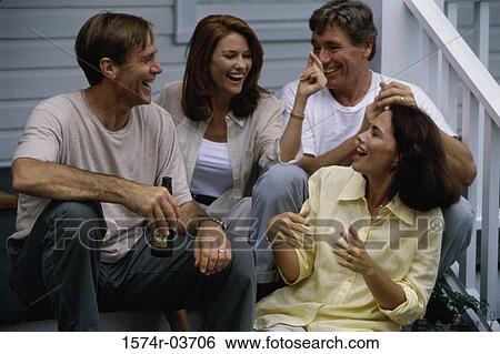 Two mid adult couples sitting on steps View Large Photo Image Stock Photograph - Two mid adult couples sitting on steps. Fotosearch