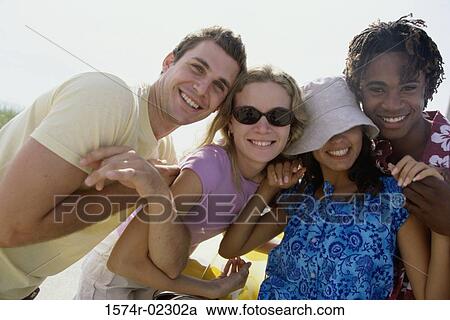 Two teenage couples on the beach View Large Photo Image Stock Image - Two teenage couples on the beach. Fotosearch